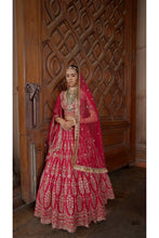 Load image into Gallery viewer, FUSCHIA RED RAW SILK BRIDAL LEHENGA CHOLI WITH A TULLE DUPATTA AND AN OPTIONAL SECOND TULLE DUPATTA