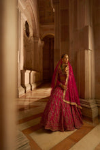 Load image into Gallery viewer, FUSCHIA RED RAW SILK BRIDAL LEHENGA CHOLI WITH A TULLE DUPATTA AND AN OPTIONAL SECOND TULLE DUPATTA
