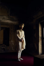 Load image into Gallery viewer, IVORY RAW SILK SHERWANI WITH KURTA AND CHURIDAR WITH AN OPTIONAL WORKED BELT, STOLE AND JUTIS