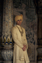 Load image into Gallery viewer, GOLD RAW SILK SHERWANI WITH KURTA AND CHURIDAR WITH AN OPTIONAL WORKED BELT, STOLE AND JUTIS.
