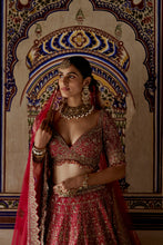 Load image into Gallery viewer, RED RAW SILK LEHENGA CHOLI WITH A NET DUPATTA AND AN OPTIONAL SECOND TISSUE DUPATTA WHICH CAN BE ORDERED SEPARATELY