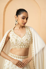 Load image into Gallery viewer, Intricate hand-embelishment of mirrors, pearls, sequin and cutdana beads. all over lehenga, blouse and dupatta border.