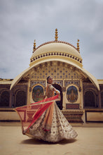 Load image into Gallery viewer, GOLD TISSUE LEHENGA CHOLI WITH A PEACH TISSUE DUPATTA AND AN OPTIONAL RED DUPTTA AND BELT WHICH CAN BE ORDERED SEPATATELY.