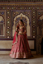 Load image into Gallery viewer, RED RAW SILK LEHENGA CHOLI WITH A NET DUPATTA AND AN OPTIONAL SECOND TISSUE DUPATTA WHICH CAN BE ORDERED SEPARATELY