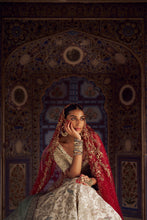 Load image into Gallery viewer, SILVER TISSUE LEHENGA CHOLI SET WITH AQUA NET DUPATTA AND AN OPTIONAL RED NET DUPATTA AND A HEAD VEIL WHICH CAN BE ORDERED SEPARATELY