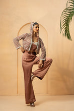 Load image into Gallery viewer, Intricate embelishment of pearls, cutdana, beads, and crystal stones on blouse , hoodie, and side of the pant.