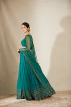 Load image into Gallery viewer, TEAL GREEN ANTIQUE SEQ WORK LEHENGA SET