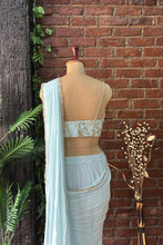 Load image into Gallery viewer, Powder Blue Pre-draped saree with Zari work Bustier
