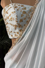 Load image into Gallery viewer, Powder Blue Pre-draped saree with Zari work Bustier
