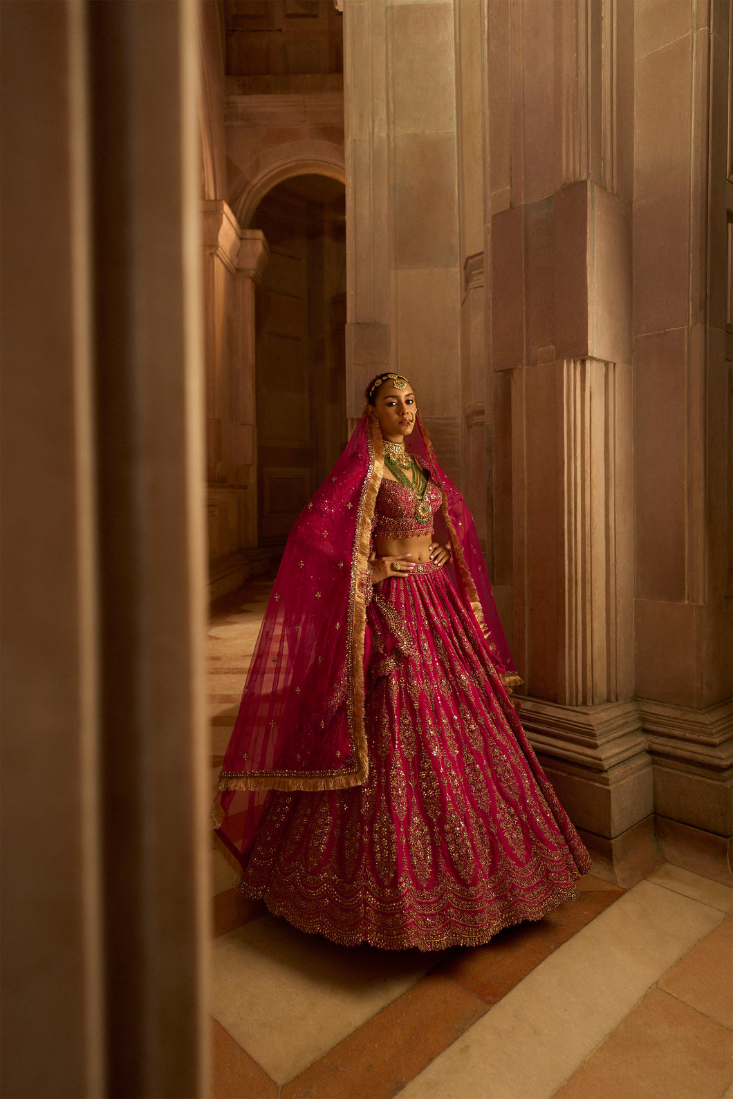 FUSCHIA RED  RAW SILK BRIDAL LEHENGA CHOLI WITH A TULLE DUPATTA AND AN OPTIONAL SECOND TULLE DUPATTA