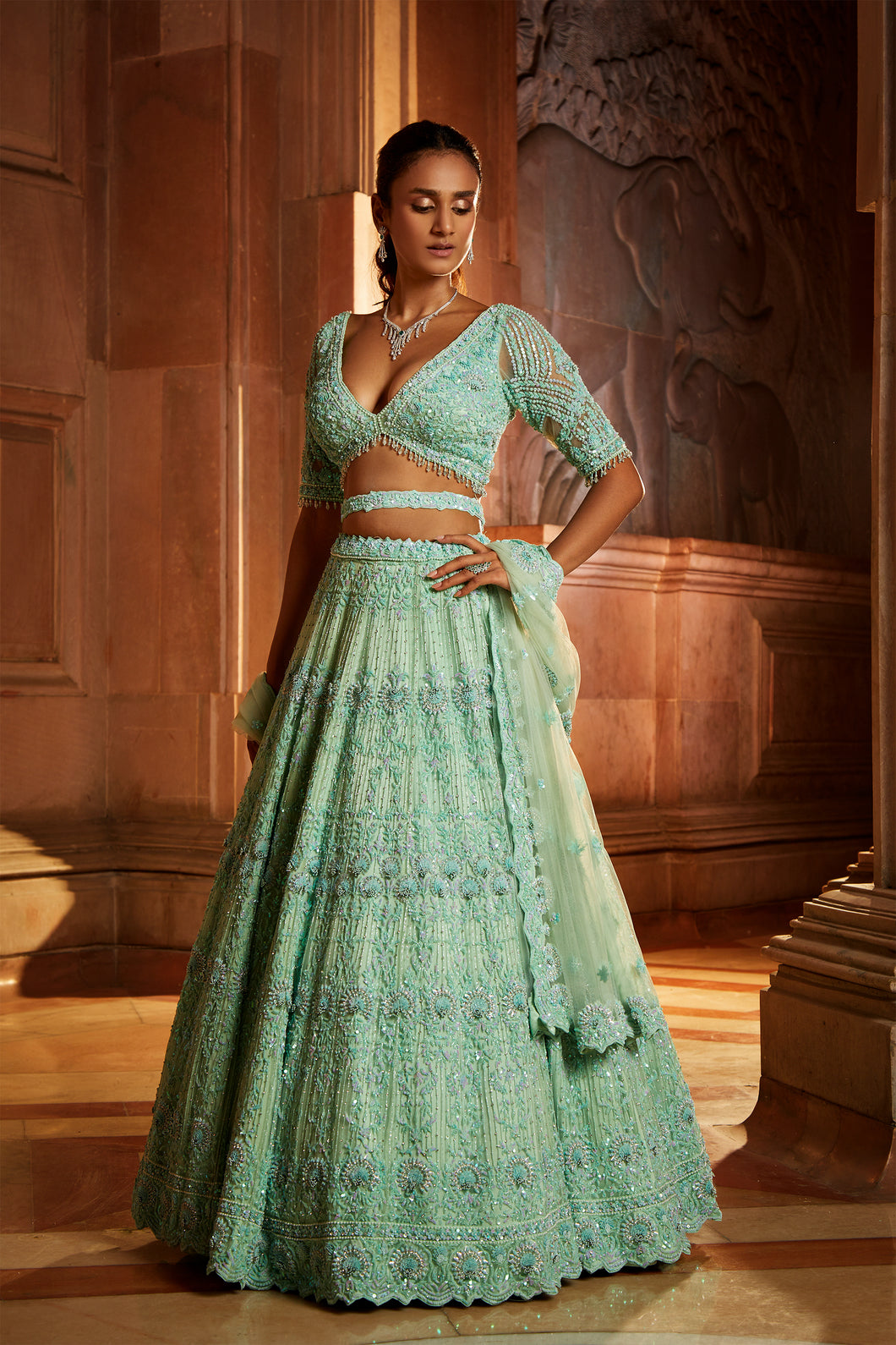 VIBRANT MINT GREEN TULLE LEHENGA CHOLI DUPATAA WITH A WORKED BELT