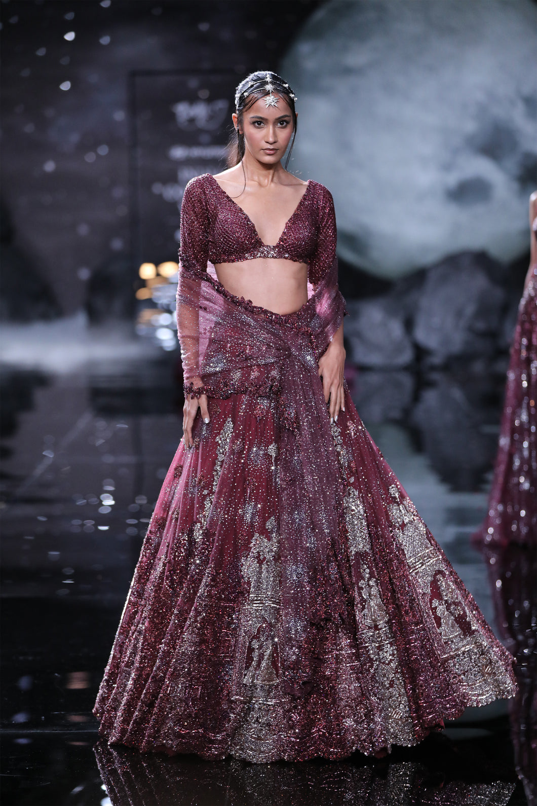 Crystal sheeted choli paired with Embroidered and cutwork edge shimmer tulle dupatta