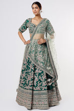 Load image into Gallery viewer, Bottle green raw silk heavily hand Embroidered lehenga

