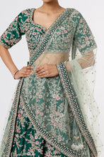 Load image into Gallery viewer, Bottle green raw silk heavily hand Embroidered lehenga
