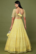 Load image into Gallery viewer, Yellow net sequins and cutdana embroidered lehenga
