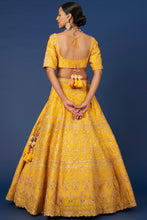 Load image into Gallery viewer, Mustard raw silk sequins and thread embroidered lehenga
