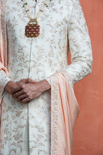 Load image into Gallery viewer, IVORY RAW SILK EMBROIDERED SHERWANI WITH MONGA TASSAR SILK KURTA AND CHURIDAR
