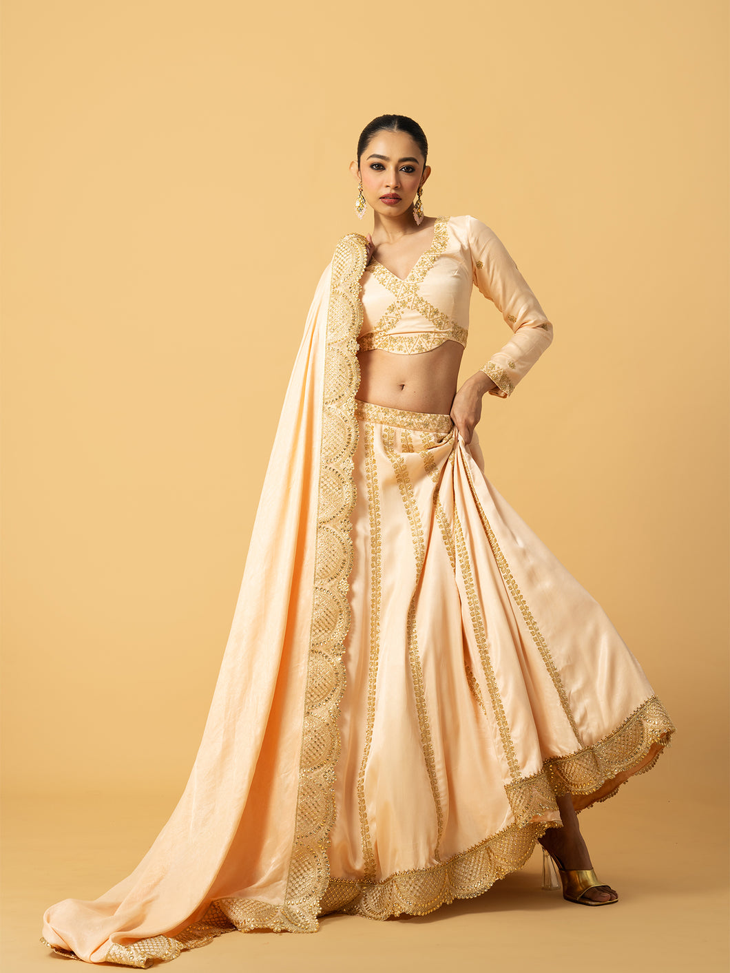 Peach modal satin full sleeve lehenga with hand embroidered work and lace on dupatta