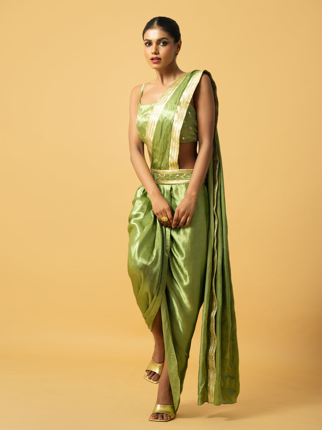 Bright mint green modal satin dhoti saree with hand embroidery on blouse & golden lace on saree pallu