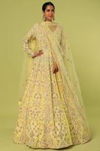 Load image into Gallery viewer, Yellow raw silk heavily embroidered jacket lehenga
