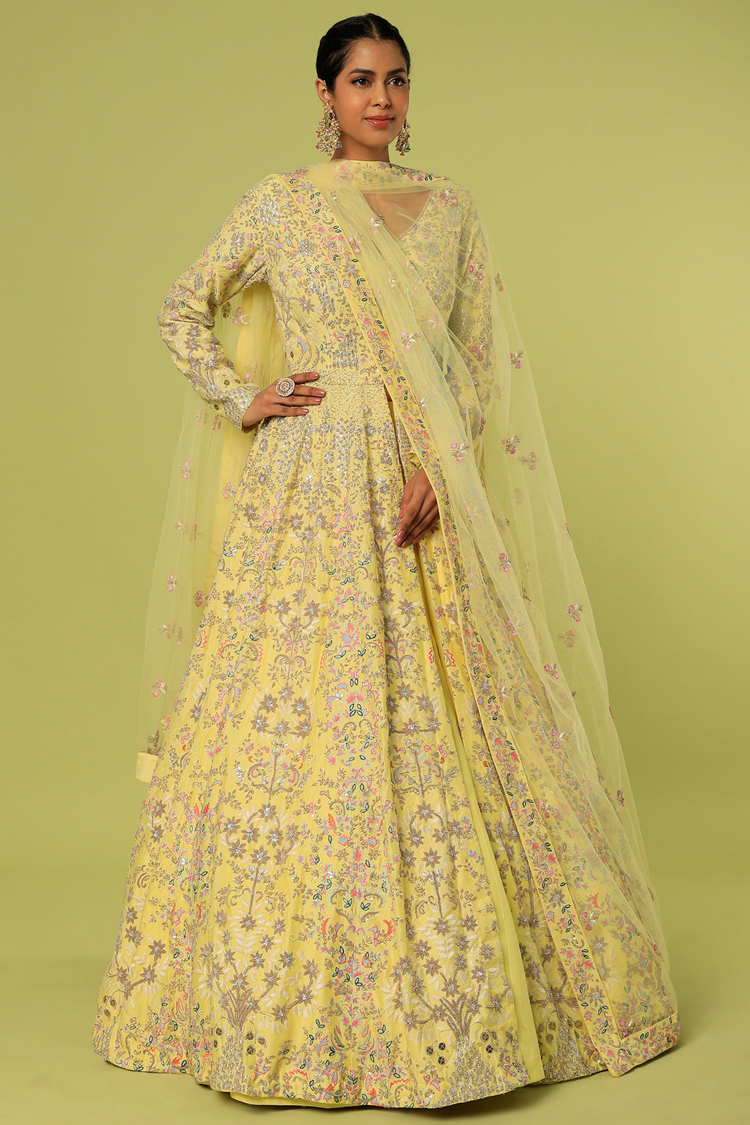 Yellow raw silk heavily embroidered jacket lehenga